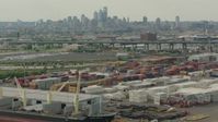 HD stock footage aerial video of the Downtown Philadelphia skyline seen while passing containers at a shipping port, Pennsylvania Aerial Stock Footage | PP003_092