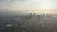 4K stock footage aerial video of Downtown New Orleans and Superdome with view of rising sun, Louisiana Aerial Stock Footage | PVED01_008