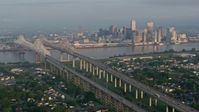 4K stock footage aerial video orbit Crescent City Connection Bridge and Downtown New Orleans at sunrise, Louisiana Aerial Stock Footage | PVED01_016