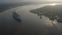 4K stock footage aerial video Carnival Cruise ship sailing the Mississippi River at sunrise, New Orleans, Louisiana Aerial Stock Footage | PVED01_029
