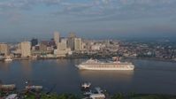 4K stock footage aerial video Carnival Cruise ship on the river to reveal Downtown New Orleans at sunrise, Louisiana Aerial Stock Footage | PVED01_030