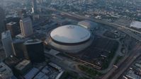 4K stock footage aerial video orbit of the Superdome and the New Orleans Arena in Downtown New Orleans at sunrise, Louisiana Aerial Stock Footage | PVED01_042