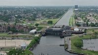 4K stock footage aerial video approach and fly over 17th Street Canal pumping station in Metairie, New Orleans, Louisiana Aerial Stock Footage | PVED01_100