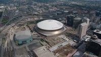 4K stock footage aerial video slow orbit of the Superdome and New Orleans Arena in Downtown New Orleans, Louisiana Aerial Stock Footage | PVED01_124