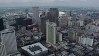 4K stock footage aerial video fly over hotels and skyscrapers in Downtown New Orleans to reveal Superdome, Louisiana Aerial Stock Footage | PVED01_144