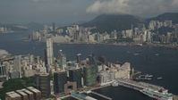 5K stock footage aerial video of Kowloon waterfront office buildings and Victoria Harbor in Hong Kong, China Aerial Stock Footage | SS01_0008