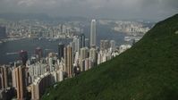 5K stock footage aerial video approach Hong Kong Island high-rises from green mountains in China Aerial Stock Footage | SS01_0040