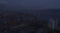 5K stock footage aerial video fly over the Port of Hong Kong to approach Stonecutters Bridge at night, China Aerial Stock Footage | SS01_0113