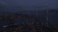 5K stock footage aerial video fly over containers at the Port of Hong Kong toward center of Stonecutters Bridge at night in China Aerial Stock Footage | SS01_0115