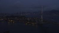 5K stock footage aerial video approach Port of Hong Kong at end of the Stonecutters Bridge at night in China Aerial Stock Footage | SS01_0117
