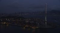 5K stock footage aerial video approach the shore of the Port of Hong Kong at night, China Aerial Stock Footage | SS01_0118