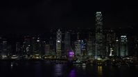 5K stock footage aerial video approach Hong Kong Island skyscrapers across Victoria Harbor at night, China Aerial Stock Footage | SS01_0217