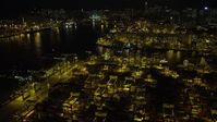 5K stock footage aerial video fly over rows of shipping containers at night at the Port of Hong Kong, China Aerial Stock Footage | SS01_0235