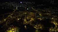 5K stock footage aerial video flyby cargo cranes and wide streets at the Port of Hong Kong at night, China Aerial Stock Footage | SS01_0240