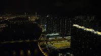 5K stock footage aerial video of tall apartment complexes by the channel at night on Tsing Yi Island, Hong Kong, China Aerial Stock Footage | SS01_0257