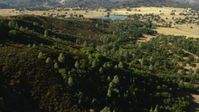 1080 stock footage aerial video of flyby mountain and over trees toward lake in San Jose, California Aerial Stock Footage | TS01_127