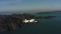 4K stock footage aerial video of a Learjet C-21 flying by Marin Hills and reveal San Francisco, California Aerial Stock Footage | WAAF02_C051_01170K
