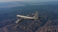 4K stock footage aerial video of revealing a Boeing KC-135 flying over mountains in Northern California Aerial Stock Footage | WAAF04_C019_0118SM