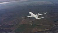 4K stock footage aerial video of flying around the tail of a Boeing C-32 above farm fields in Northern California Aerial Stock Footage | WAAF08_C020_0119PV