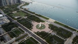 The Buckingham Fountain in Grant Park near boats in the harbor, Downtown Chicago, Illinois Aerial Stock Photos | AX0001_151.0000000F