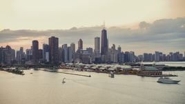 Navy Pier and the Downtown Chicago skyline on a cloudy day at sunset, Illinois Aerial Stock Photos | AX0003_064.0000424F