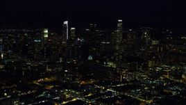 The city skyline's tall skyscrapers at night in Downtown Los Angeles, California Aerial Stock Photos | AX0158_093.0000359