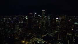 Tall city skyscrapers at night in Downtown Los Angeles, California Aerial Stock Photos | AX0158_110.0000136