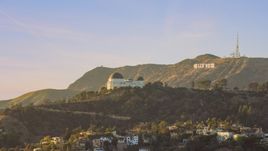 Griffith Observatory with the Hollywood Sign in the background in Los Angeles, California Aerial Stock Photos | AX0162_052.0000333