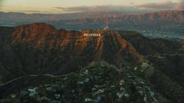 The Hollywood Sign at twilight in Los Angeles, California Aerial Stock Photos | AX0162_101.0000000