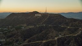 The world famous Hollywood Sign at twilight in Los Angeles, California Aerial Stock Photos | AX0162_107.0000000