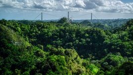 Arecibo Observatory seen from lush green mountains, Puerto Rico  Aerial Stock Photos | AX101_108.0000184F