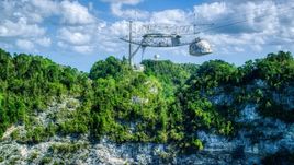 Top structure of the Arecibo Observatory and karst mountains in Puerto Rico Aerial Stock Photos | AX101_116.0000000F