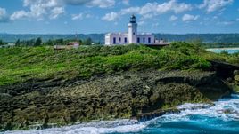 The Arecibo Lighthouse on the island coast, Puerto Rico Aerial Stock Photos | AX101_148.0000000F