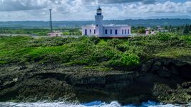 The Arecibo Lighthouse overlooking the island coast, Puerto Rico Aerial Stock Photos | AX101_148.0000244F