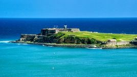 Fort San Felipe del Morro surrounded by crystal blue waters, Old San Juan, Puerto Rico Aerial Stock Photos | AX101_235.0000000F