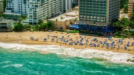 Tourists enjoying clear blue waters and the Caribbean beach, San Juan, Puerto Rico Aerial Stock Photos | AX102_004.0000129F
