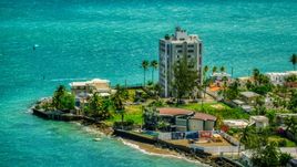 Oceanfront homes and a kite surfer in San Juan, Puerto Rico Aerial Stock Photos | AX102_007.0000151F