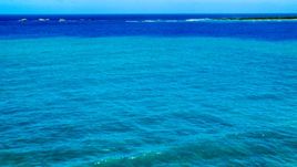 Tiny islands across blue Caribbean ocean in Fajardo, Puerto Rico  Aerial Stock Photos | AX102_071.0000275F