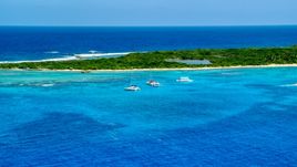 Catamarans near a Caribbean island in tropical blue waters, Rada Fajardo, Puerto Rico Aerial Stock Photos | AX102_073.0000202F