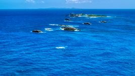 Tiny Caribbean islands in tropical blue waters, Puerto Rico  Aerial Stock Photos | AX102_087.0000074F