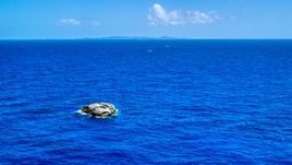 Tiny island in a deep blue ocean near Culebra, Puerto Rico  Aerial Stock Photos | AX102_091.0000000F