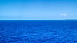 Sapphire ocean waters of the Atlantic Ocean  Aerial Stock Photos | AX102_094.0000000F