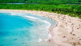 Sunbathers on a white sand Caribbean beach in Culebra, Puerto Rico  Aerial Stock Photos | AX102_112.0000187F