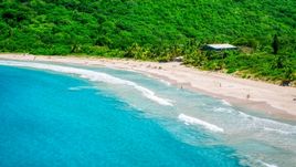 Sapphire blue waters by tourists on a white sand Caribbean beach, Culebra, Puerto Rico  Aerial Stock Photos | AX102_113.0000000F