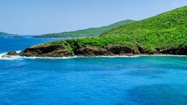 Sapphire blue waters and a rugged island coastline, Culebra, Puerto Rico  Aerial Stock Photos | AX102_115.0000000F