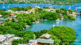 Boats in a cove at a small oceanside island town, Culebra, Puerto Rico  Aerial Stock Photos | AX102_151.0000000F