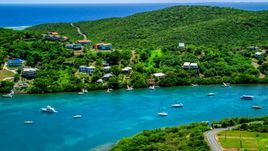Oceanfront island homes by boats in sapphire waters, Culebra, Puerto Rico Aerial Stock Photos | AX102_155.0000201F