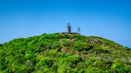 The hilltop Culebrita Lighthouse in Puerto Rico  Aerial Stock Photos | AX102_177.0000274F