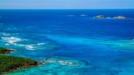 Tiny islands in sapphire blue ocean in the Caribbean, Culebrita, Puerto Rico  Aerial Stock Photos | AX102_179.0000133F