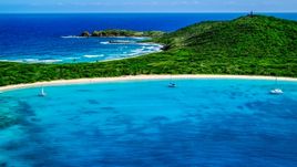 Catamarans in turquoise blue waters beside a white sand Caribbean beach, Culebrita, Puerto Rico  Aerial Stock Photos | AX102_182.0000258F